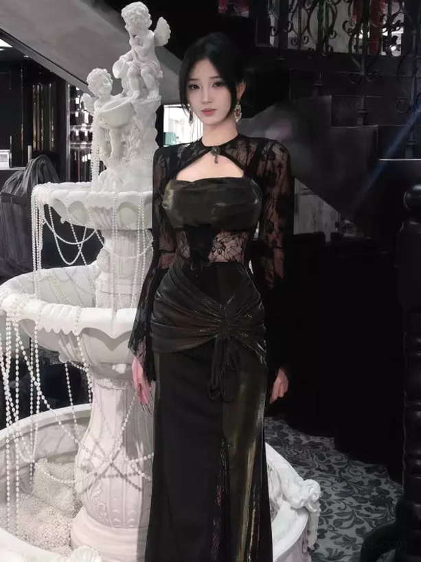 Full body front view of black gothic lolita maxi dress with cutout square neck, lace bolero sleeves, ruched waist, and dramatic high slit skirt