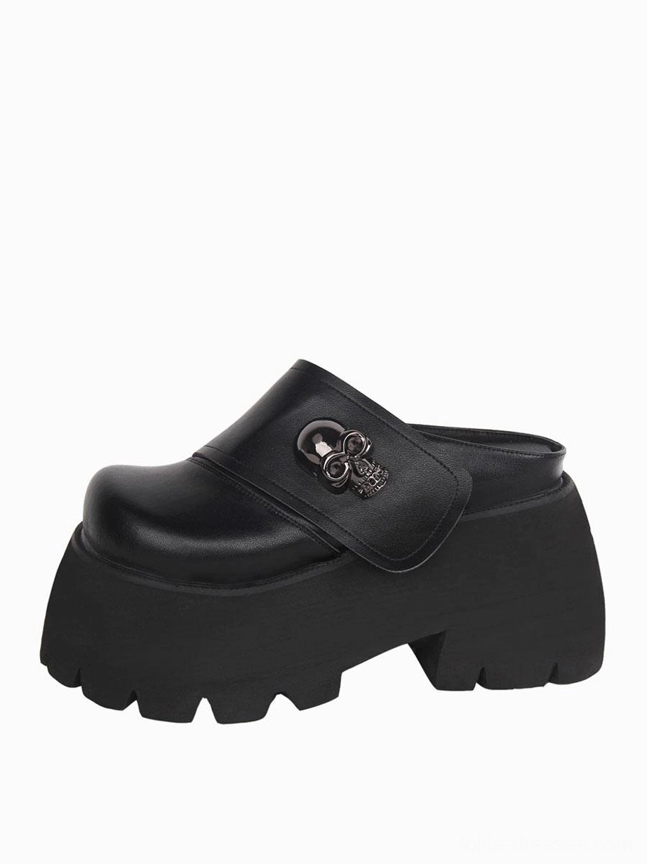 Black Gothic platform mule shoes front three-quarter view detailed silver skull strap thick lug platform sole