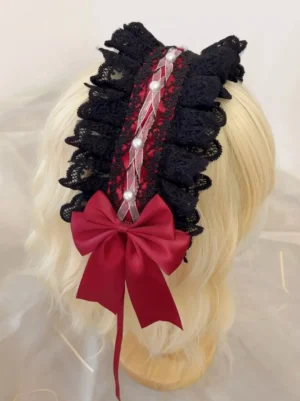 Black and red ruffled lace bow hairband with pearl trims displayed on blonde short curly wig mannequin, back view showing layered lace construction, satin bow detail, gothic lolita headdress