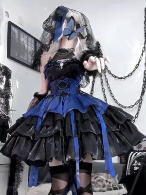 Gothic Lolita black and royal blue color block jumper dress with layered ruffled skirt, front three-quarter view showcasing butterfly embellishments and lace details