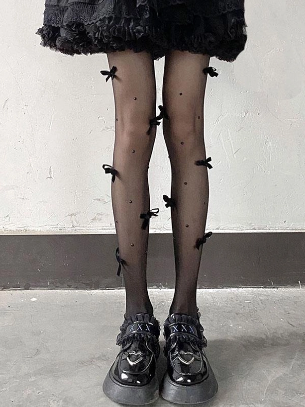 Gothic lolita sheer tights full front leg view tiny black bows dotted accents sheer black fabric black ruffled skirt platform loafers