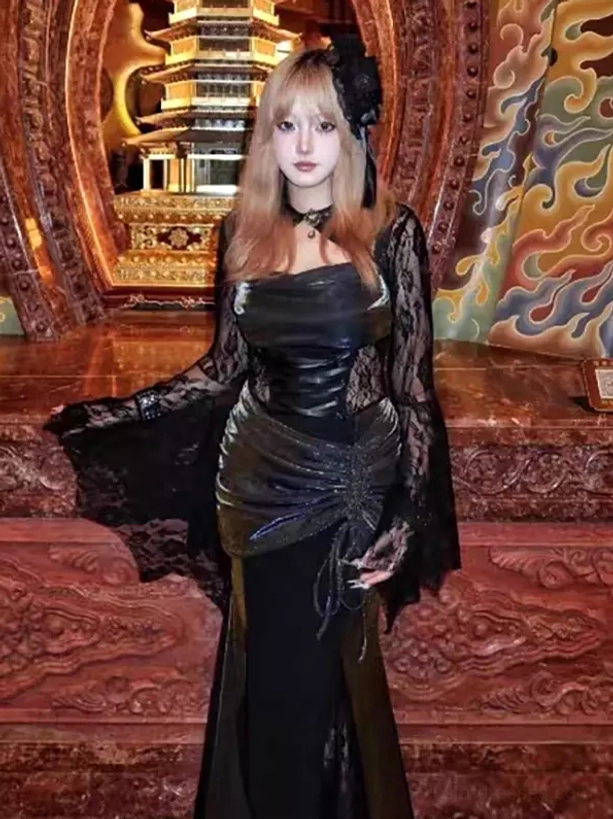 Full length gothic lolita velvet maxi dress with flared lace sleeves, ruched bodice, high-low hemline, and choker accessory worn by model in oriental vintage interior