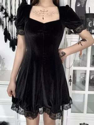 Black velvet Gothic Lolita mini dress with square sweetheart neckline and lace-trimmed puff short sleeves, full-body front view on model