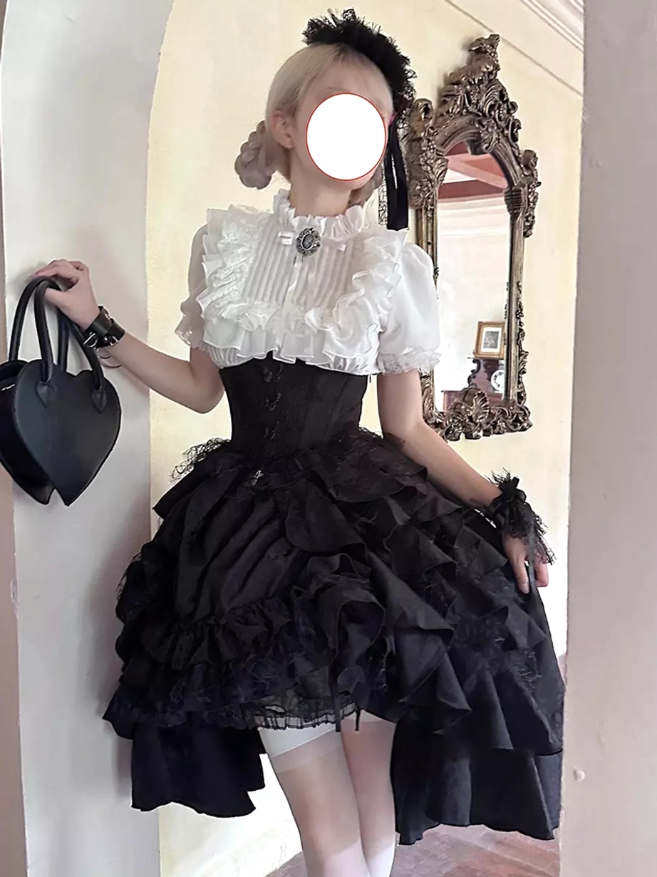 Gothic lolita black-and-white two-piece dress set showing contrasting blouse and ruffled skirt combination with jacquard fabric and lace trim details