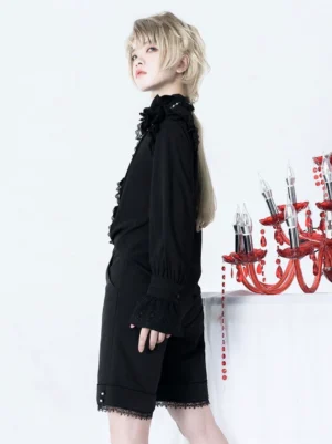 Black Gothic Lolita blouse side profile male model with candle ruffled sleeve trims elegant