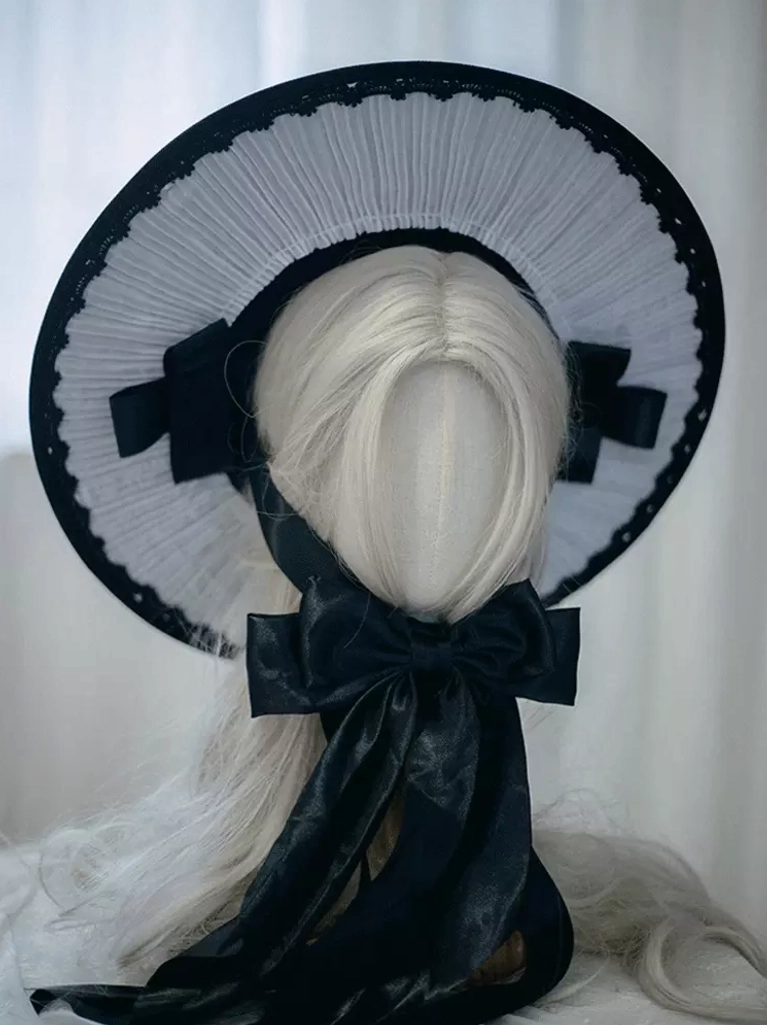 Gothic Lolita bonnet hat back three-quarter view displaying oversized back satin bow with long flowing ribbons