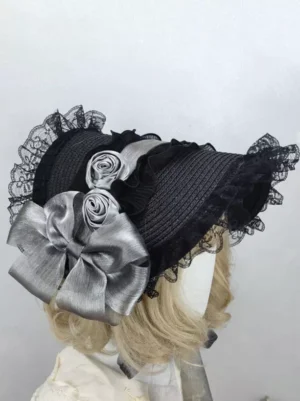 Gothic Lolita black tea party bonnet back view with lace ruffles and silver-gray satin roses on mannequin