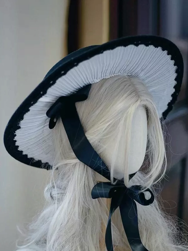 Gothic Lolita bonnet hat side view highlighting thin adjustable hat straps and small lower bow knot embellishment