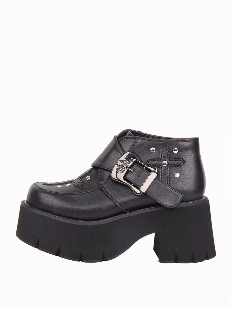 Single right shoe view of black gothic lolita boot showing cross embroidery with rivets and adjustable metal buckle strap hardware