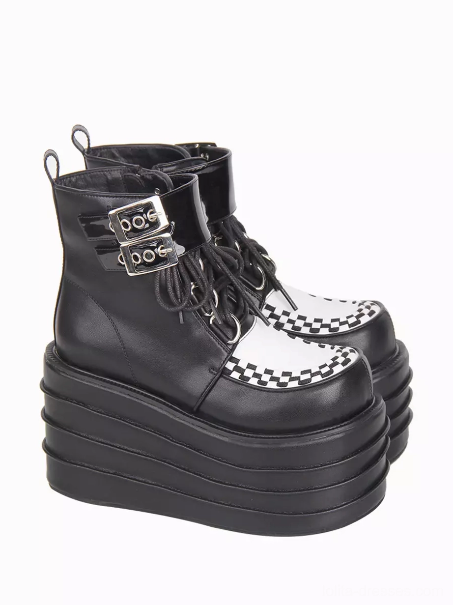 Left front three-quarter view of gothic lolita boots emphasizing dual buckle strap hardware and lace-up closure construction