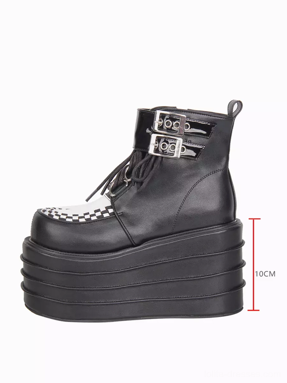 Right side profile of gothic lolita boots displaying ten centimeter stacked multi-layered platform sole and wedge heel construction