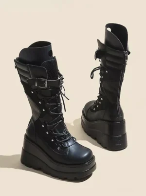 Side and rear angled view of gothic lolita black boots showing padded ankle buckle strap and chunky wedge platform heel