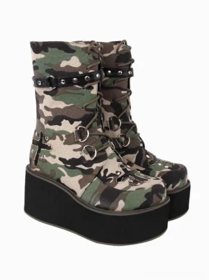 Gothic lolita mid-calf boots side profile displaying camouflage woven fabric, studded leather strap with cross decorations, metal lace grommets, and black platform sole