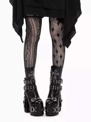 Gothic lolita platform boots styled on model wearing patterned fishnet tights and black asymmetric skirt, front lower body view