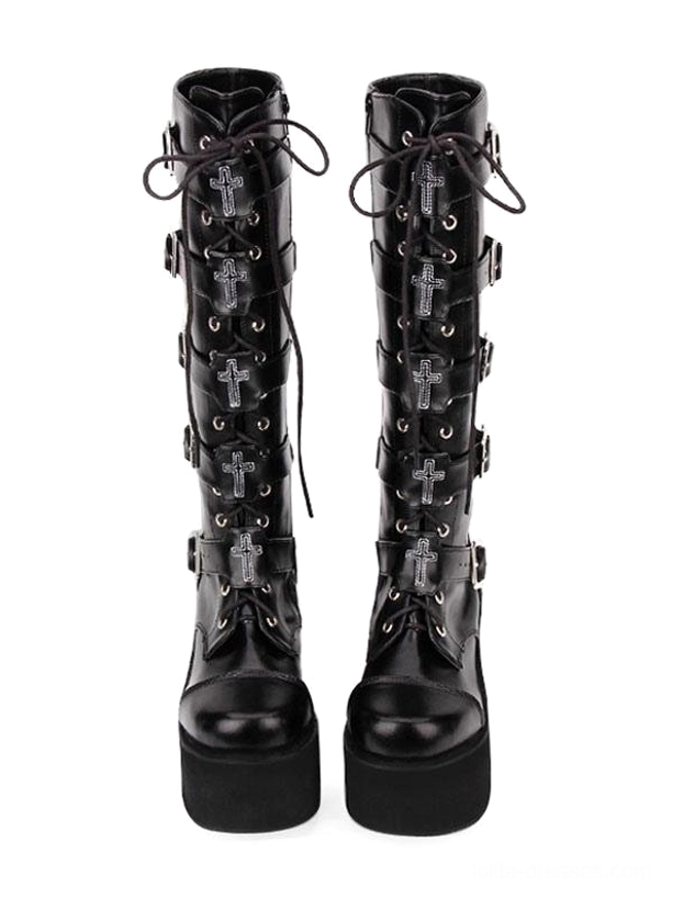 Close-up of silver square metal buckle hardware with cross motif and leather strap on Gothic Lolita boots decorative elements
