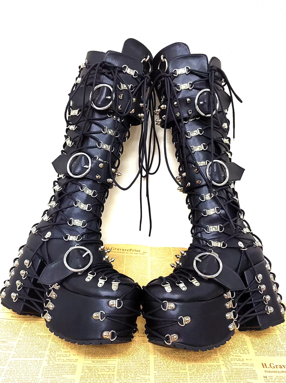 gothic lolita platform boots pair front tilted angle view showing multiple silver circular buckles chunky platform wedge heel thick sole vintage setting