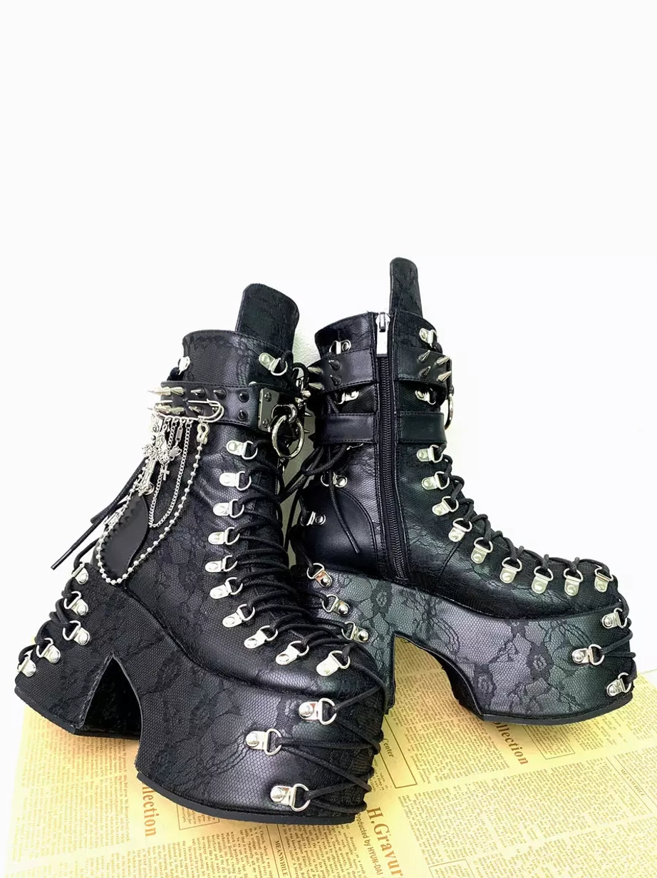Back three-quarter view of gothic lolita platform boots showing visible side zipper heel lace-up hardware embossed leather and silver metal fittings