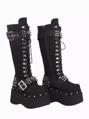 Gothic Lolita knee-high platform boots showcasing side zipper, metal buckles, rivet embellishments, and thick platform wedge heel, oblique side angle on white background