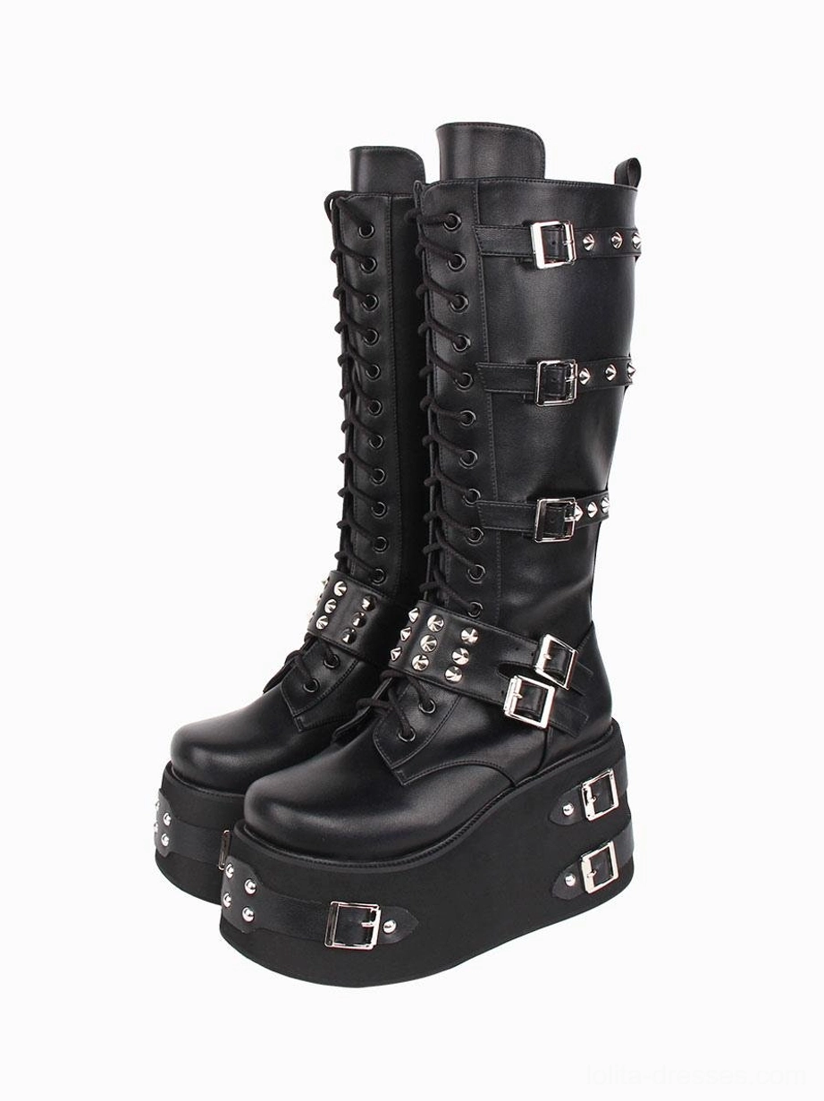Gothic lolita boots frontal three-quarter view displaying lace-up front studded straps thick wedge platform sole