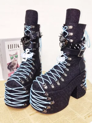 gothic-lolita-wedge-platform-boots-studded-ankle-straps-metal-hardware-three-quarter-view-newspaper-background
