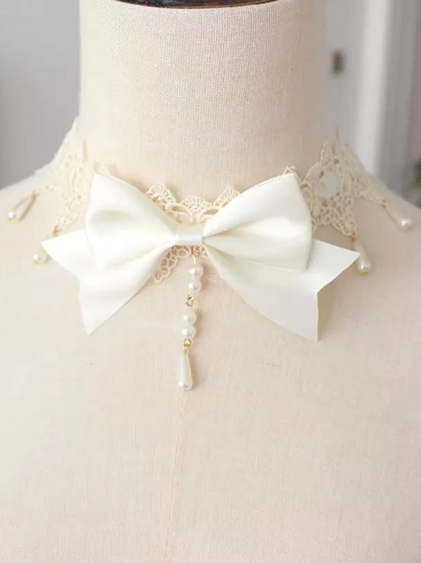 White ivory gothic lolita bow choker with cream lace trim and pearl drop tassel detail front view mannequin neck