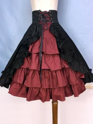 Gothic Lolita burgundy and black tiered ruffle skirt front three-quarter view with lace-up corset waistband and ruffled overlay panels