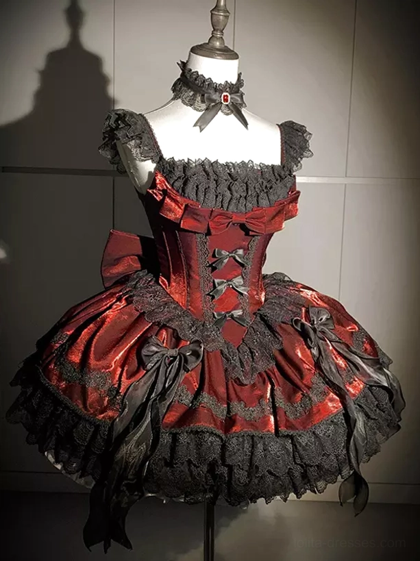 Gothic Lolita burgundy mini dress three-quarter view with large side satin bows and lace-trimmed skirt on mannequin