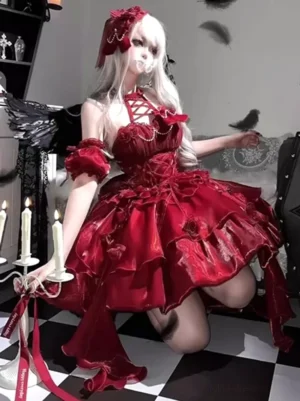 Gothic Lolita burgundy dress side profile kneeling pose with off-shoulder ruffled cuffs, short layered ruffled skirt, back trailing ribbons, candleholder styling