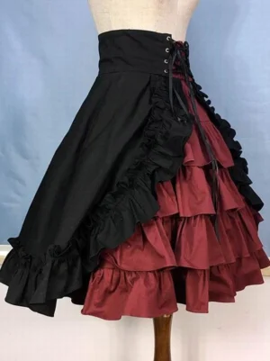 Gothic Lolita high-waisted burgundy skirt side three-quarter angle showing corset lace-up closure and structured black ruffle detail
