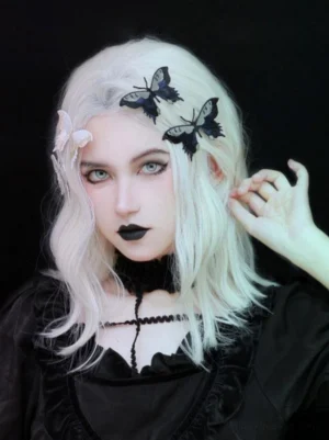 Gothic lolita white and black butterfly hair clips 3D metal headwear front portrait close-up view platinum blonde wavy wig dark makeup