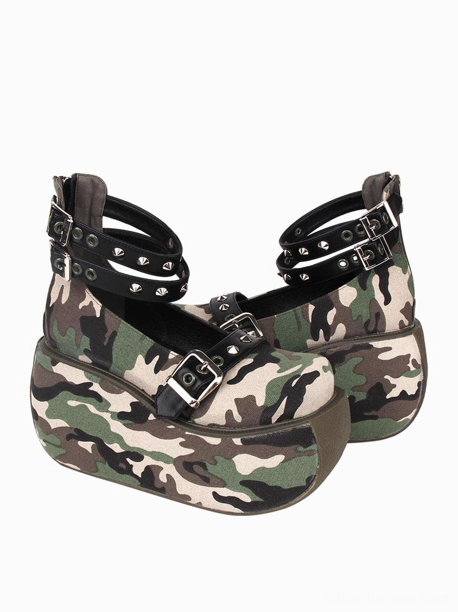 Camouflage canvas lolita platform pump oblique angle displaying buckle vamp studded ankle straps and patterned upper material