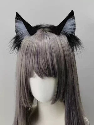 Gothic Lolita cat ear headband showing black outer ears with pale blue-grey inner fur and fluffy black base trim, modeled on mannequin