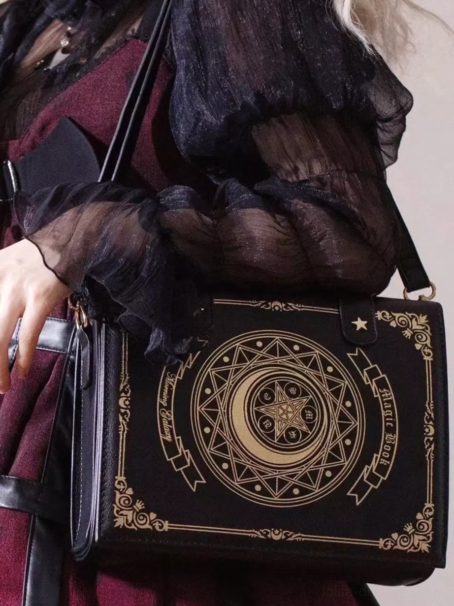 Gothic Lolita coffee brown crossbody bag with golden moon star celestial print, paired with dark frilly Lolita outfit and metal decorative hardware details