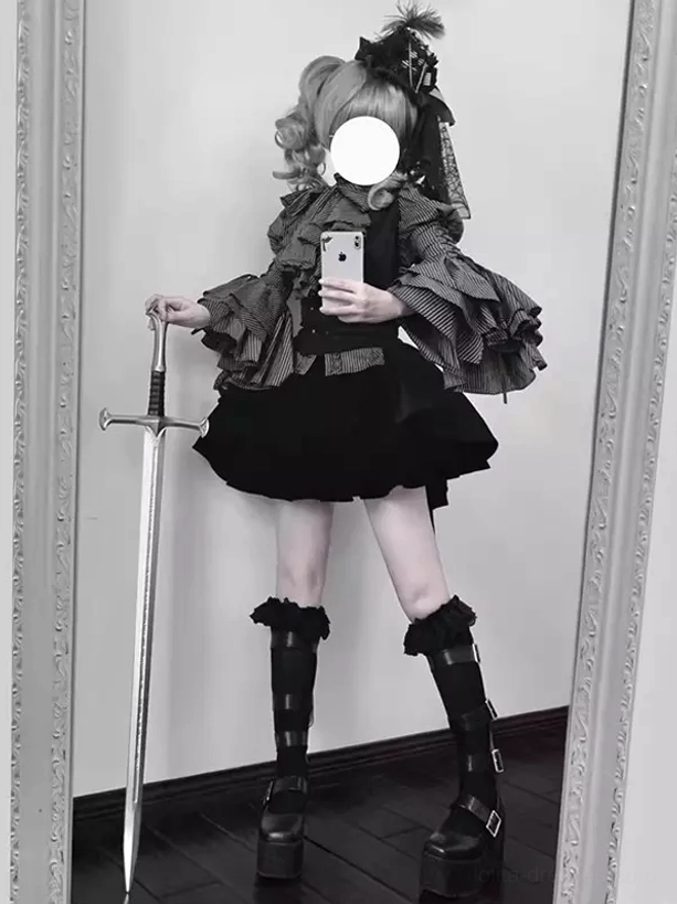 Full-length rear side view of complete Gothic Lolita outfit set showing platform buckle boots, twin curly hairstyle, lace hair accessory, and tiered skirt layering in mirror background