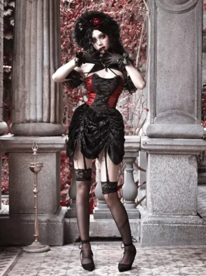 Gothic Lolita dress back three-quarter view showing garter straps and structured pleated skirt, model posing with hands near face wearing sheer black stockings and high heels