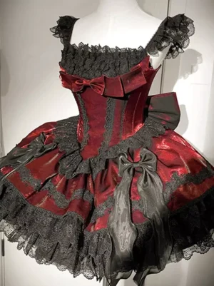 Gothic Lolita corset dress close-up front detail showing square off-shoulder lace trim and layered ruffled skirt hem