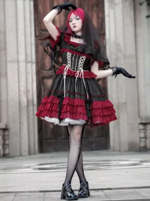 Gothic lolita corset dress three-quarter front view featuring lace-up bodice, tiered ruffled skirt, fishnet stockings and lace veil accessory