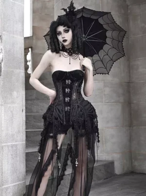 Front full-body shot of gothic lolita boned corset with metal lace-up closure and ruffled mesh overskirt on model with spiderweb umbrella against European stone stairs background