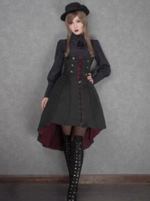 Gothic Lolita corset jumper skirt front view on model with black top hat and burgundy inner lining high-low hem