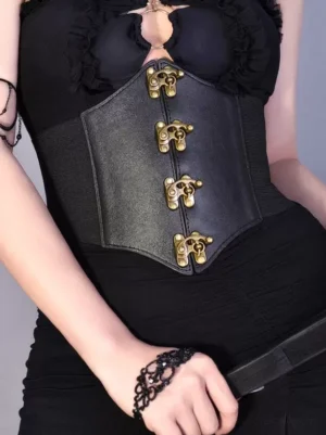 Side front view of gothic lolita corset waist belt with elastic waistband and bronze clasps on model in black goth outfit
