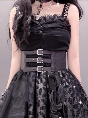 Gothic lolita corset-style waist belt front half-body view showing metallic buckle fasteners, eyelet-trimmed straps, matte black finish, worn with choker and lolita aesthetic styling