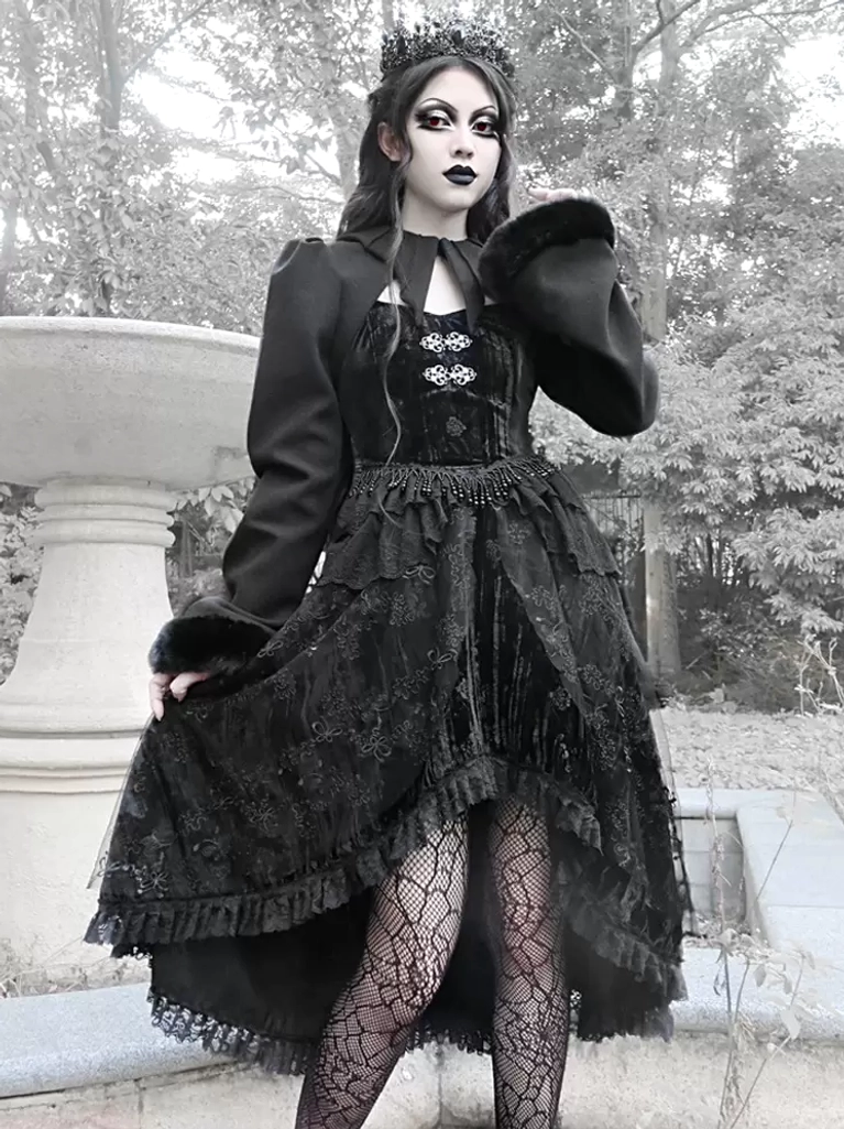 gothic-lolita-cropped-coat-full-body-front-view-model-wearing-black-polyester-coat-with-lace-skirt-outdoor-garden-setting