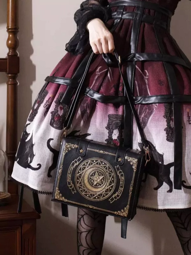 Gothic Lolita crossbody bag worn with gradient red black frilly skirt and dark Lolita coordinate, wooden interior scene