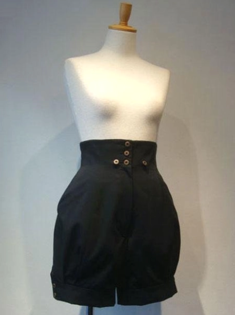 Black gothic lolita high-waisted shorts front view with metal button closure and cuffed trouser hem
