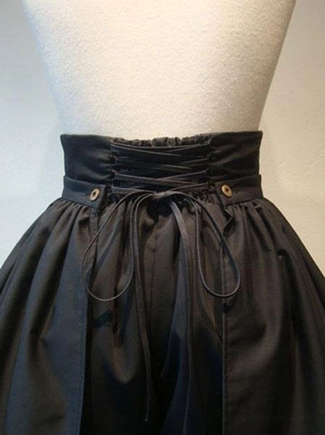 Close-up detail of black lolita culottes front waistline showing metallic buttons and lace-up corset construction