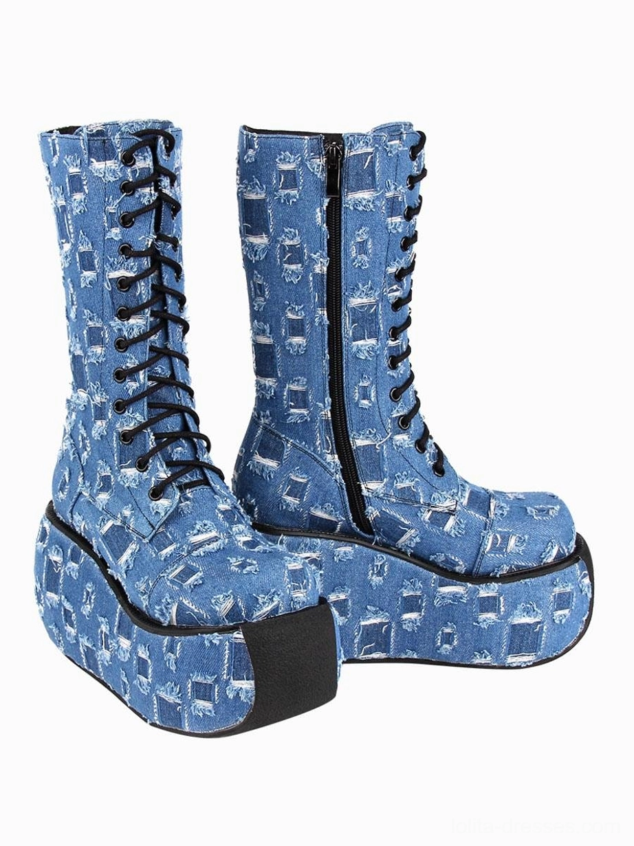 front three-quarter view of pair of distressed checkered denim platform boots with side zipper detail and all-over worn print