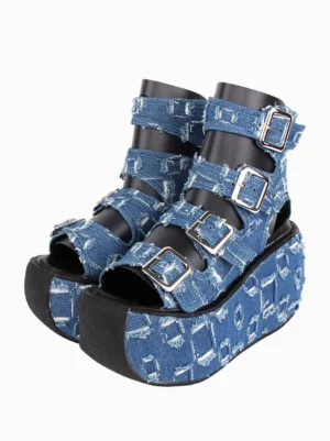 Gothic Lolita distressed denim platform sandals front three-quarter view showing frayed blue denim upper with silver square buckles and thick platform sole