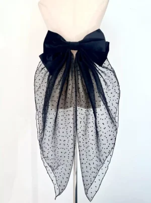 Gothic lolita detachable bow tail accessory front flat view on beige dress form with pure black velvet bow and polka-dot sheer mesh train