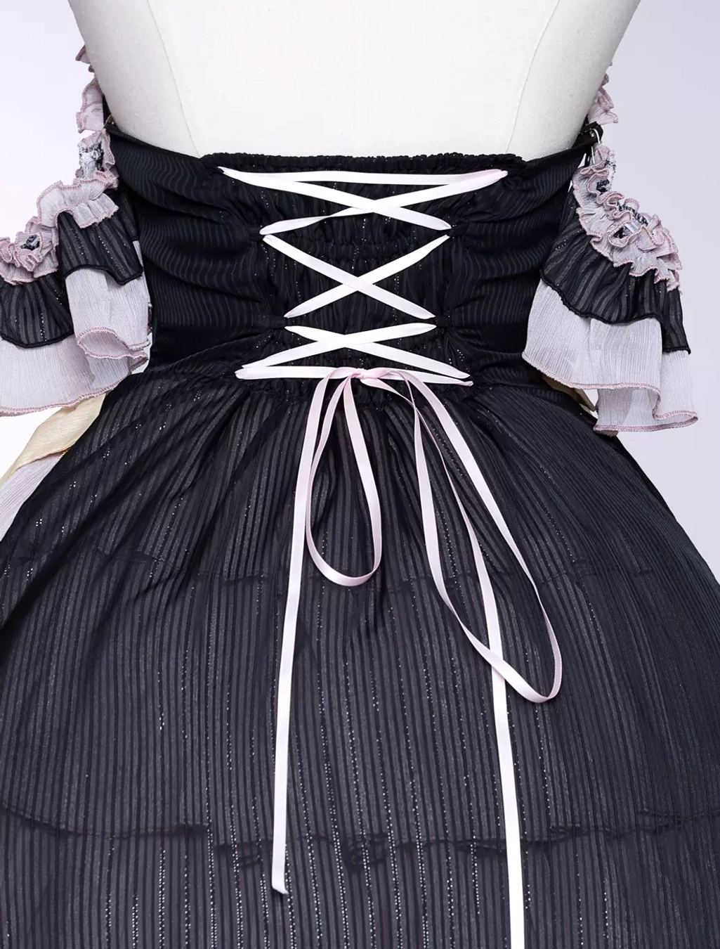 Gothic asymmetrical lolita dress back lace-up corset detail shot construction craftsmanship lacing mechanism aesthetic