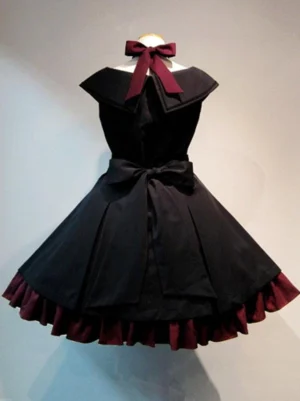 Gothic lolita dress back view with wine-red bow tie waist bow ruffled hem black fabric architectural silhouette